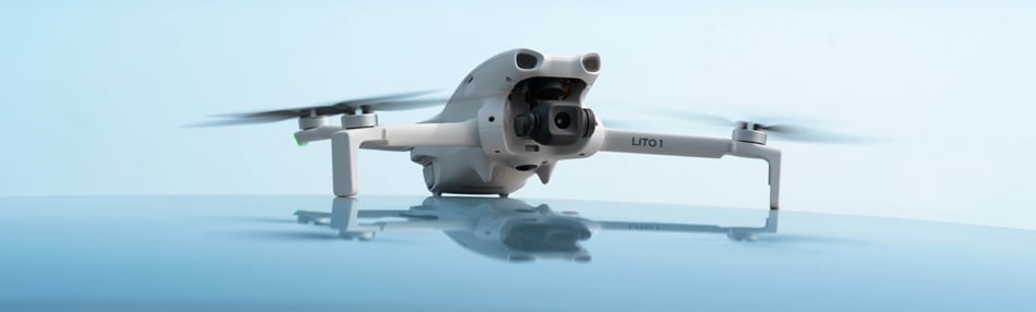 angled view of the DJI Lito 1 on a blue background with a reflection