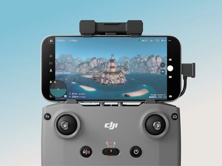 close up of a smartphone connected to the dji controller using the app