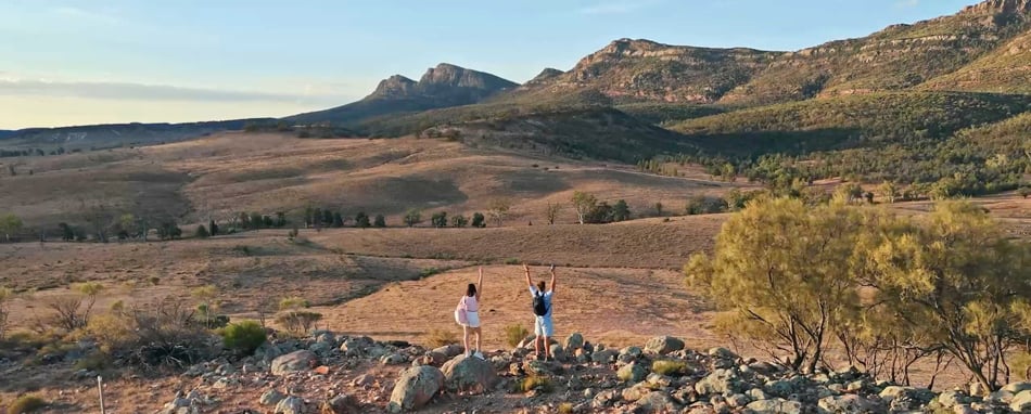 sample image of two people looking out over a rugged mountain range