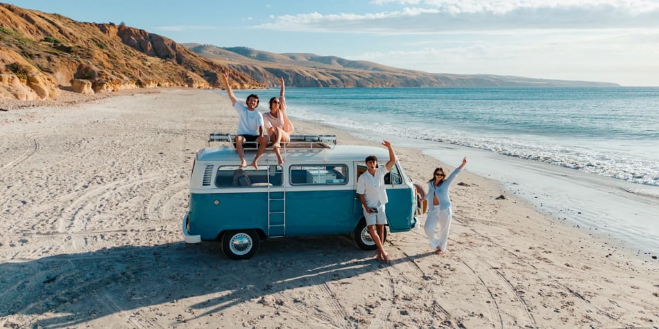 sample image of a group of people with a camper van on a beach