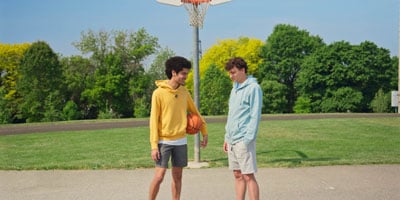 two people holding a basketball recording using the dji mic 3