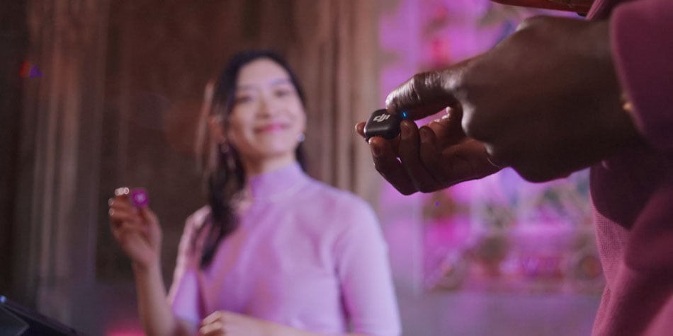 two people in a studio using different generations of the dji mic mini