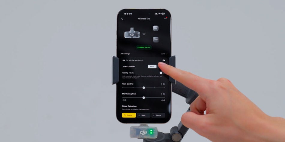 someone scrolling through the dji mic mini 2 settings on a smartphone