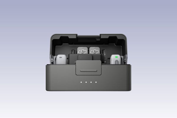 dji mic mini 2 in the charging case on a purple background