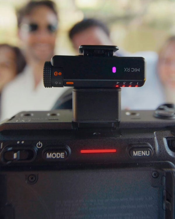 someone recording from a camera using the dji mic mini 2s reciever