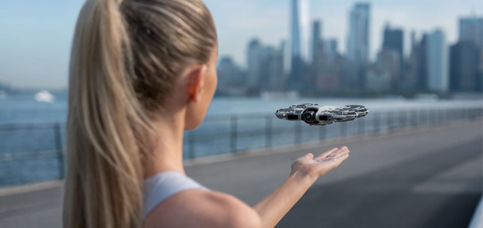 someone launching the dji neo 2 drone