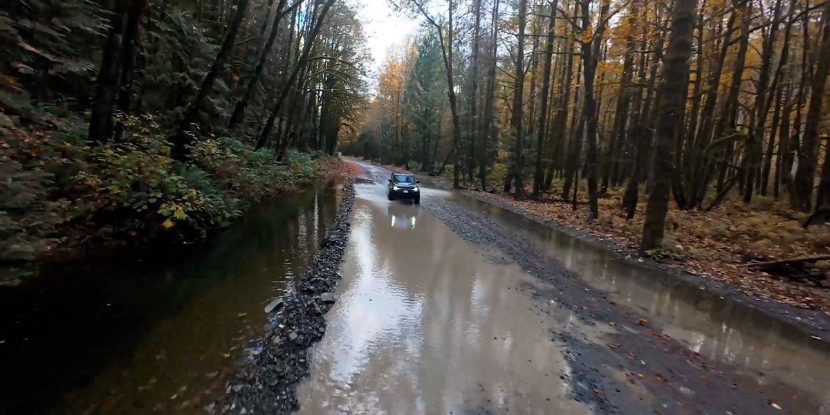 sample image of a truck driving down a flooded dirt path