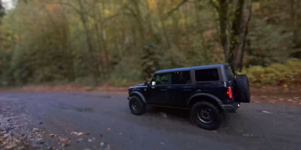 sample image of a truck driving down a forest road