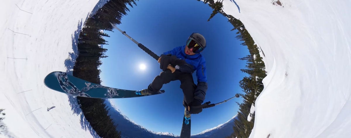 a 360-degree tiny-planet effect capturing a skier mid-air during an aerial trick