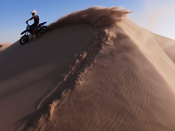 slow motion sample from the dji osmo action 6 of a dirt bike rider in the desert