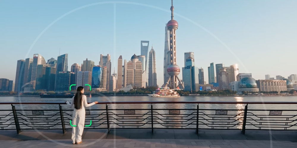 dji osmo pocket 4 tracking a woman over looking the shanghai city skyline over a river