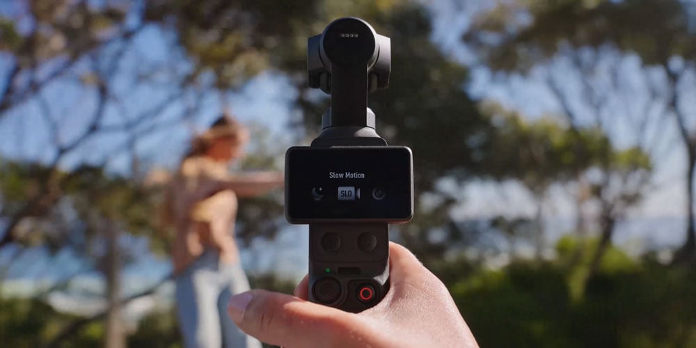 somoene about to start recording a skateboarder in slow motion using the dji osmo pocket 4