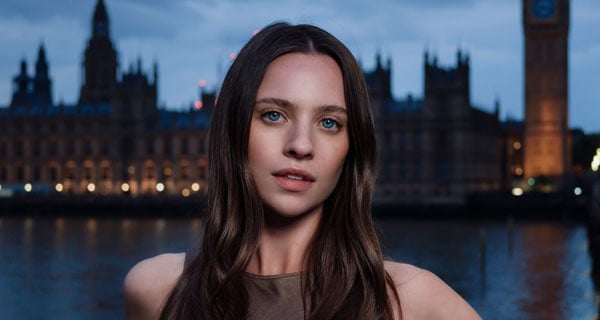 portrait of a woman at night in front of the houses of parliment