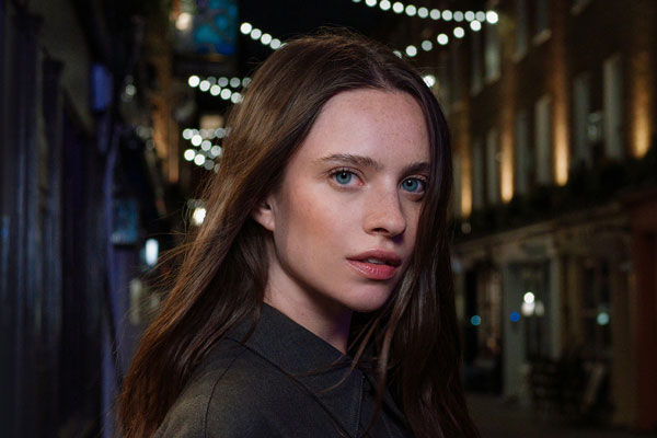 example portrait of a woman on a street at night