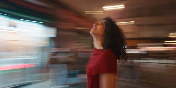 slow motion shutter still of a woman in a city