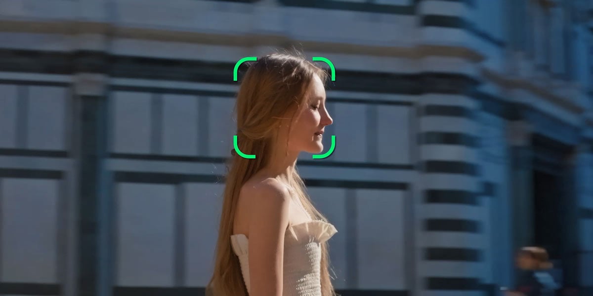 side view of a woman with a green tracking interface around her head
