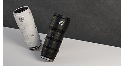 DZOFILM Catta Zoom lenses in both black and white models on a white table in front of a grey concrete effect background