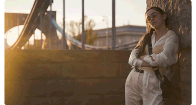 animation of woman stood in front of a stone wall as the camera zooms in to a tighter shot, DZOFILM CATTA ZOOM