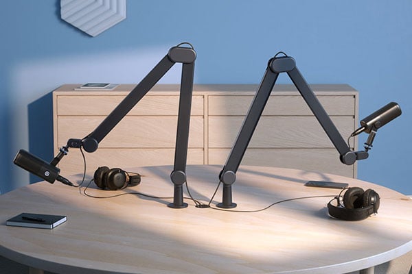 a dual podcast or interview setup featuring Elgato Wave Mic Arm MK.2