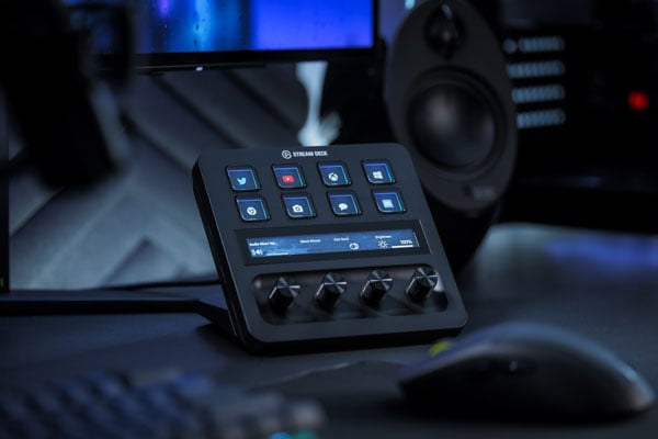 Elgato Stream Deck + on a desk under a dark bklue light