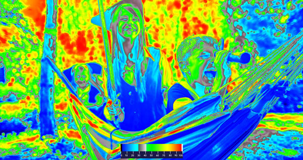Thermal camera view of kids playing in a hammock