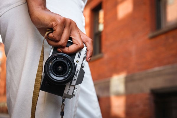 soemone holding the fujifilm camera