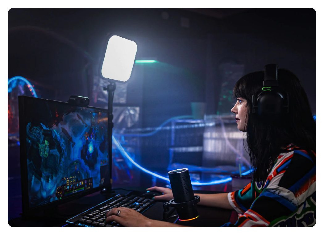 side view of a woman streaming at a desk using the godox es30 lights