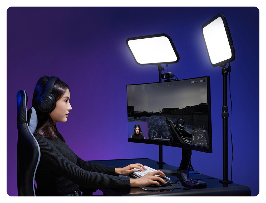 woman streaming at a desktop using the godox es45 lights