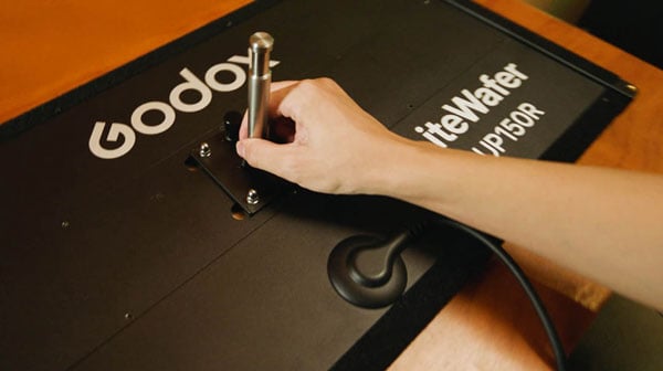 godox light being setup on a table