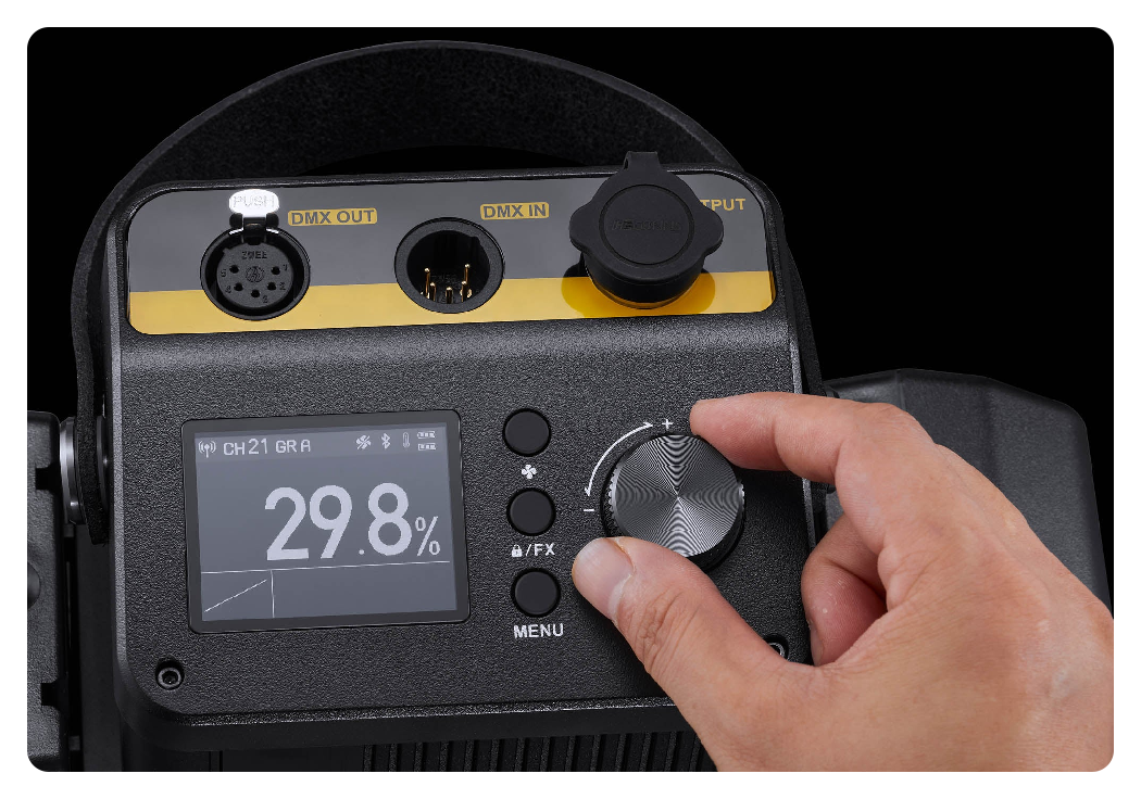 close up of someone making small adjustments on the Godox Knowled M300Bi