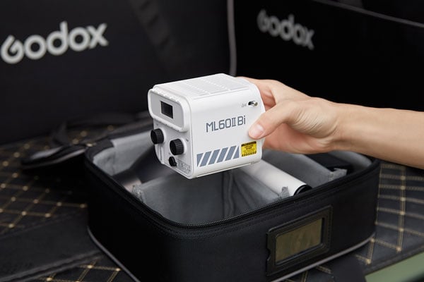 godox ml60iibi being taken out of a bag