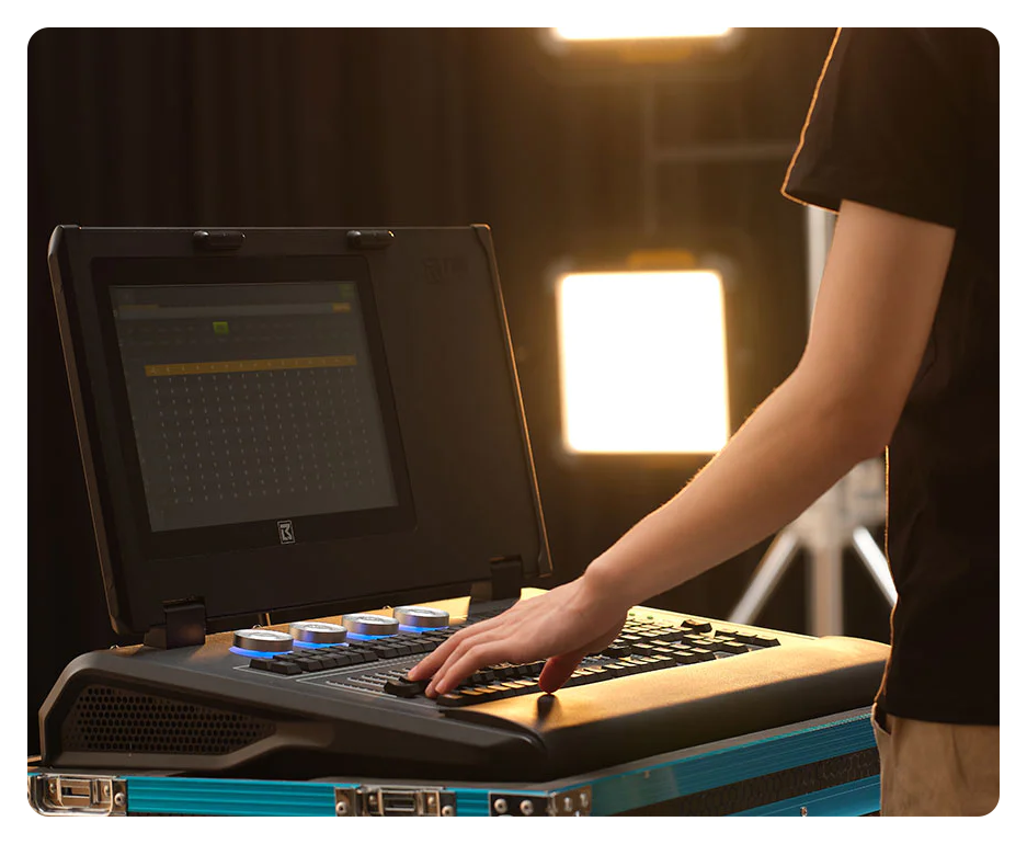 someone controlling the godox p600bi led lights at a desk