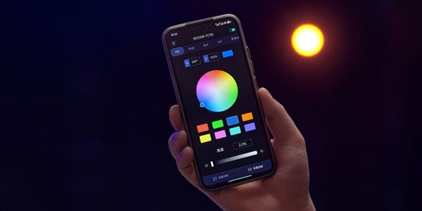someone holding a smartphone showing the godox app interface