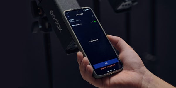someone pairing the godox app with the light using nfc
