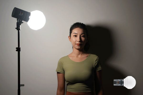 Godox light on a stand with diffuser dome attached