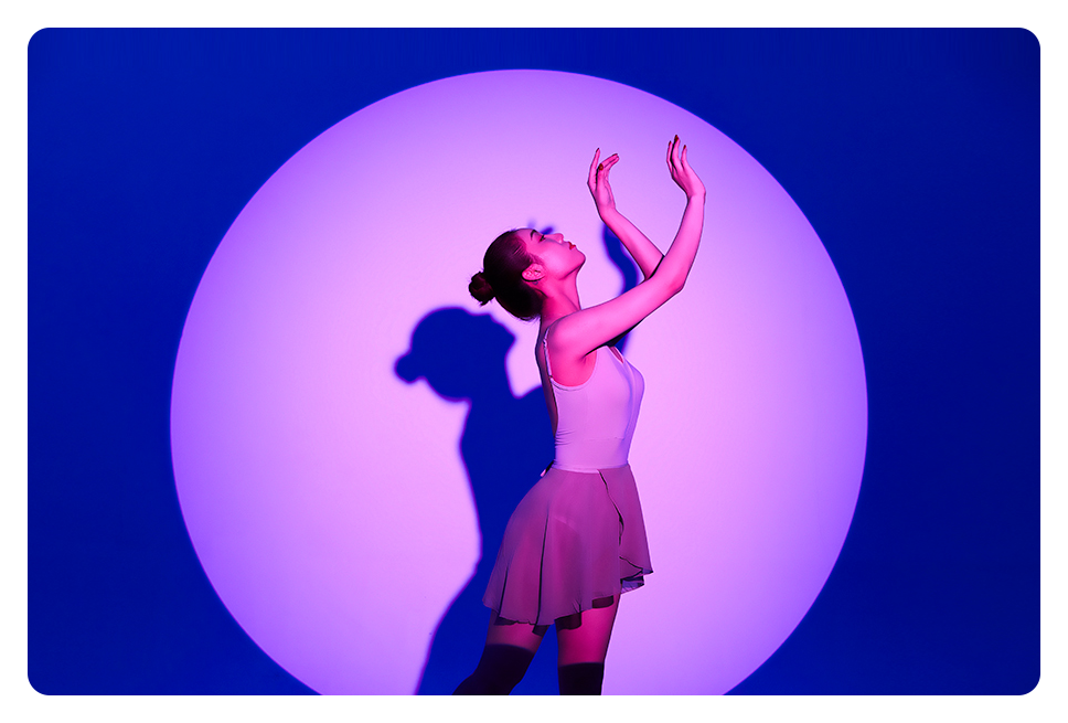 dancer in front of a purple light using the the godox attachment kit