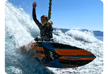 Still video frame of surfer riding waves