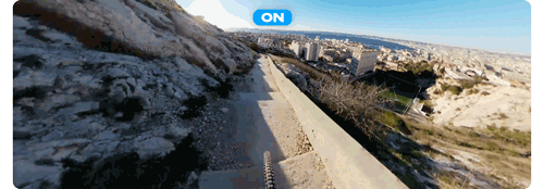 Animated gif of downhill mountain bike rider riding down steep mountain side stair case