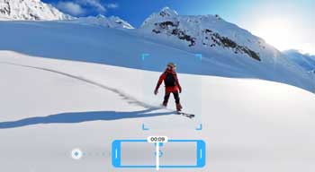 Snowboarder riding down mountain showing tracking bracket in GoPro Quik App