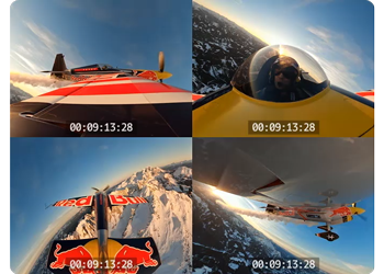 Multiview of redbull stunt plane in flight above snow covered mountain