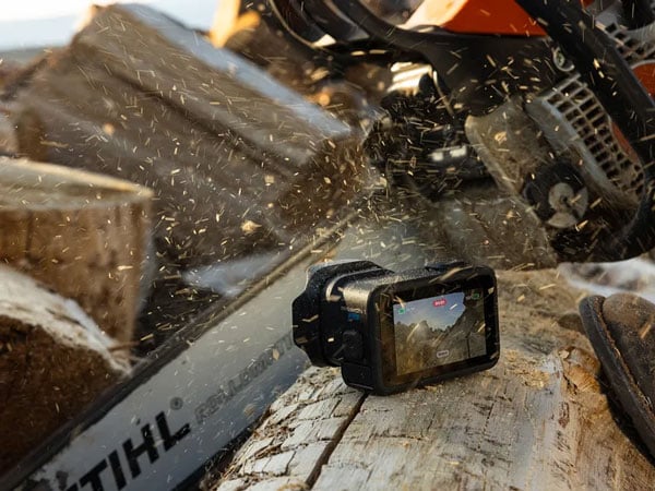 gopro mission1 sat on a log thats being cut with a chainsaw
