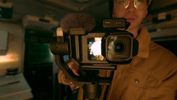 someone filming a chef using the gopro mission 1 pro attached to a gimbal