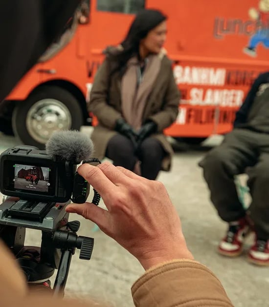 someone filming an interview using the gopro wireless mic
