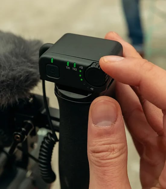 somone making adjustments on the gopro wireless mic