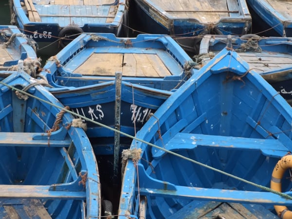 sample image of traditional bright blue wooden fishing boats