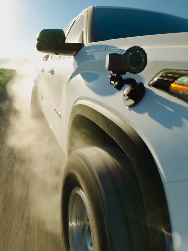 gopro mission 1 ils mounted to the side of a car