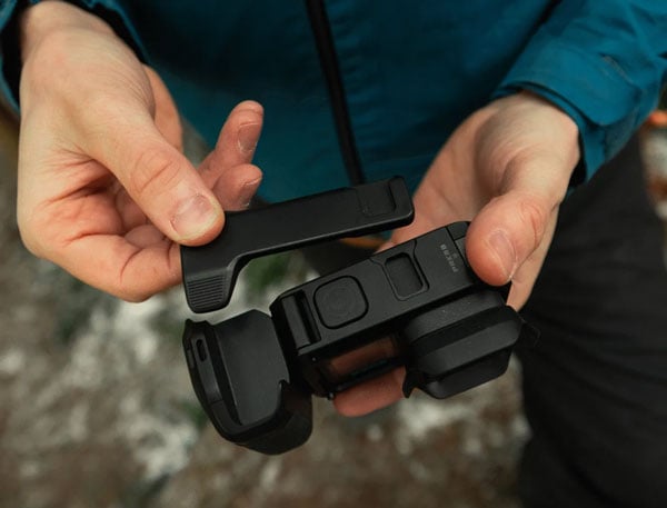 someone assembling the point-and-shoot grip around the mission 1 camera