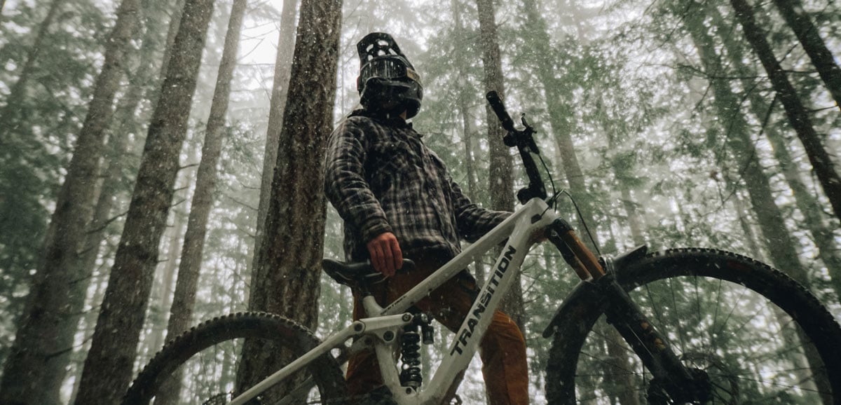 sample image of a man in the woods on a bmx bike in the rain