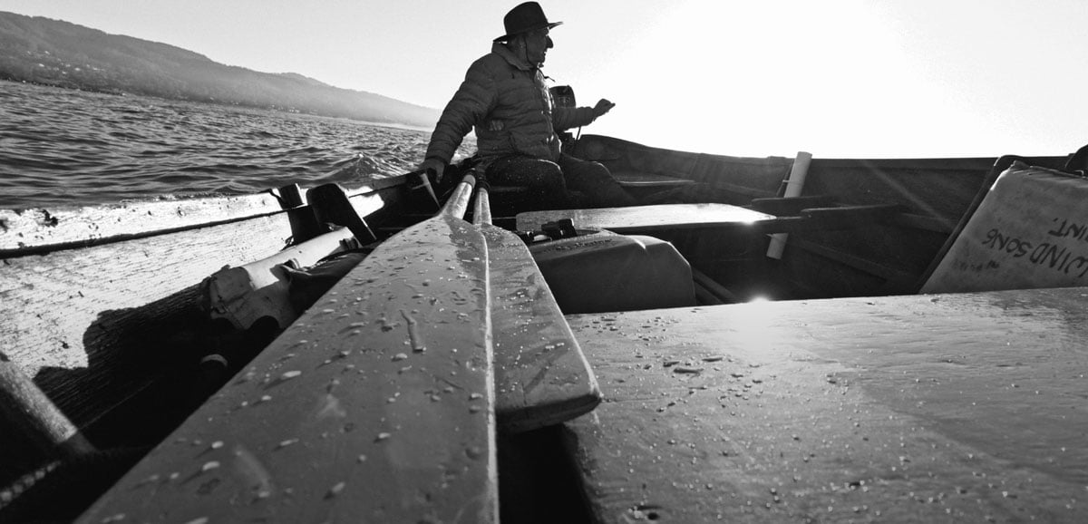 black and white sample image of a man on a boat