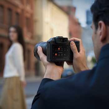 photographer shooting with hasselblad X2D II 100C medium format camera